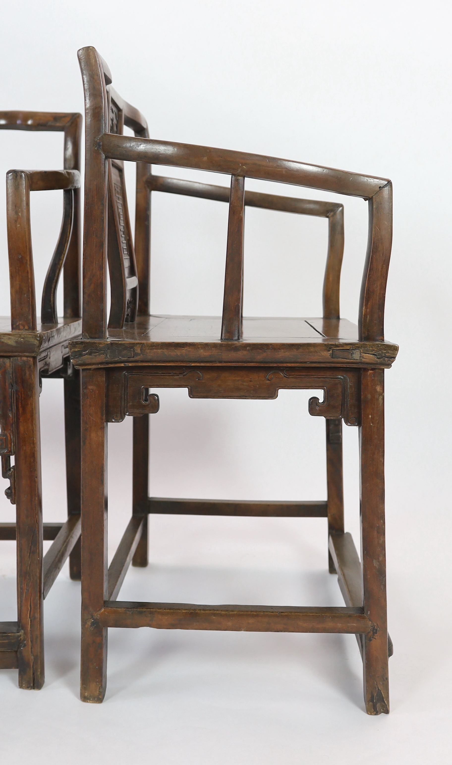 A pair of Chinese walnut armchairs, 19th century